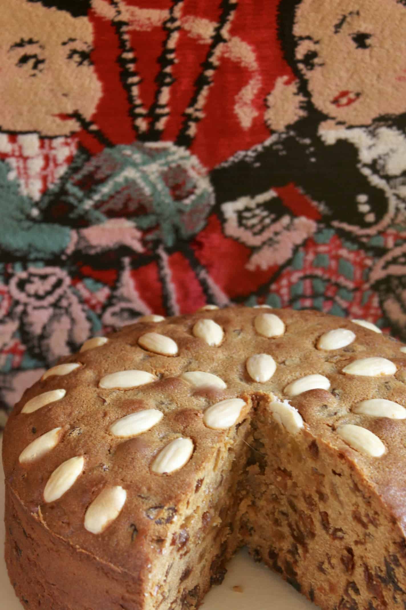 Dundee Cake with cute Scottish pillow in background