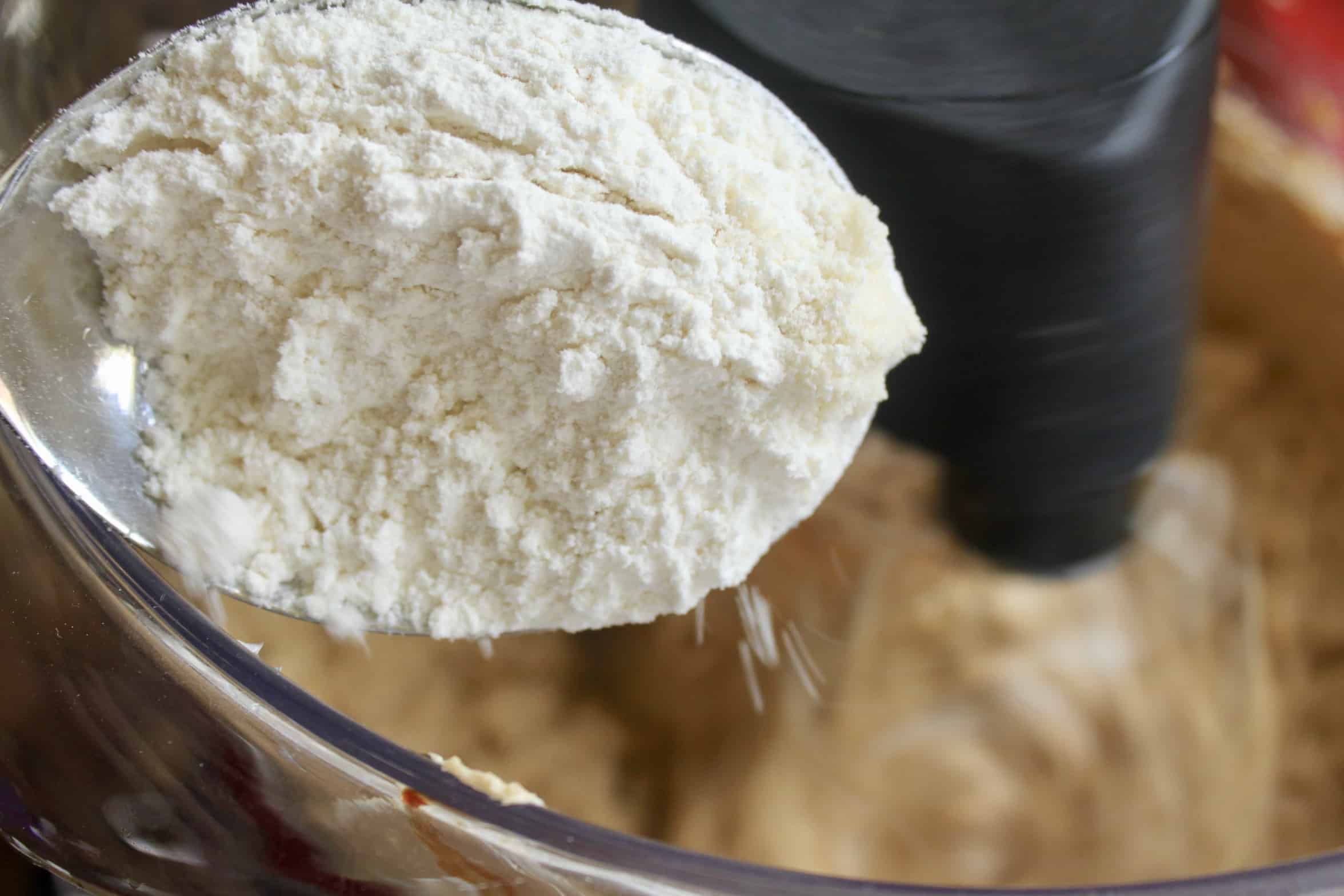 adding flour mixture to batter
