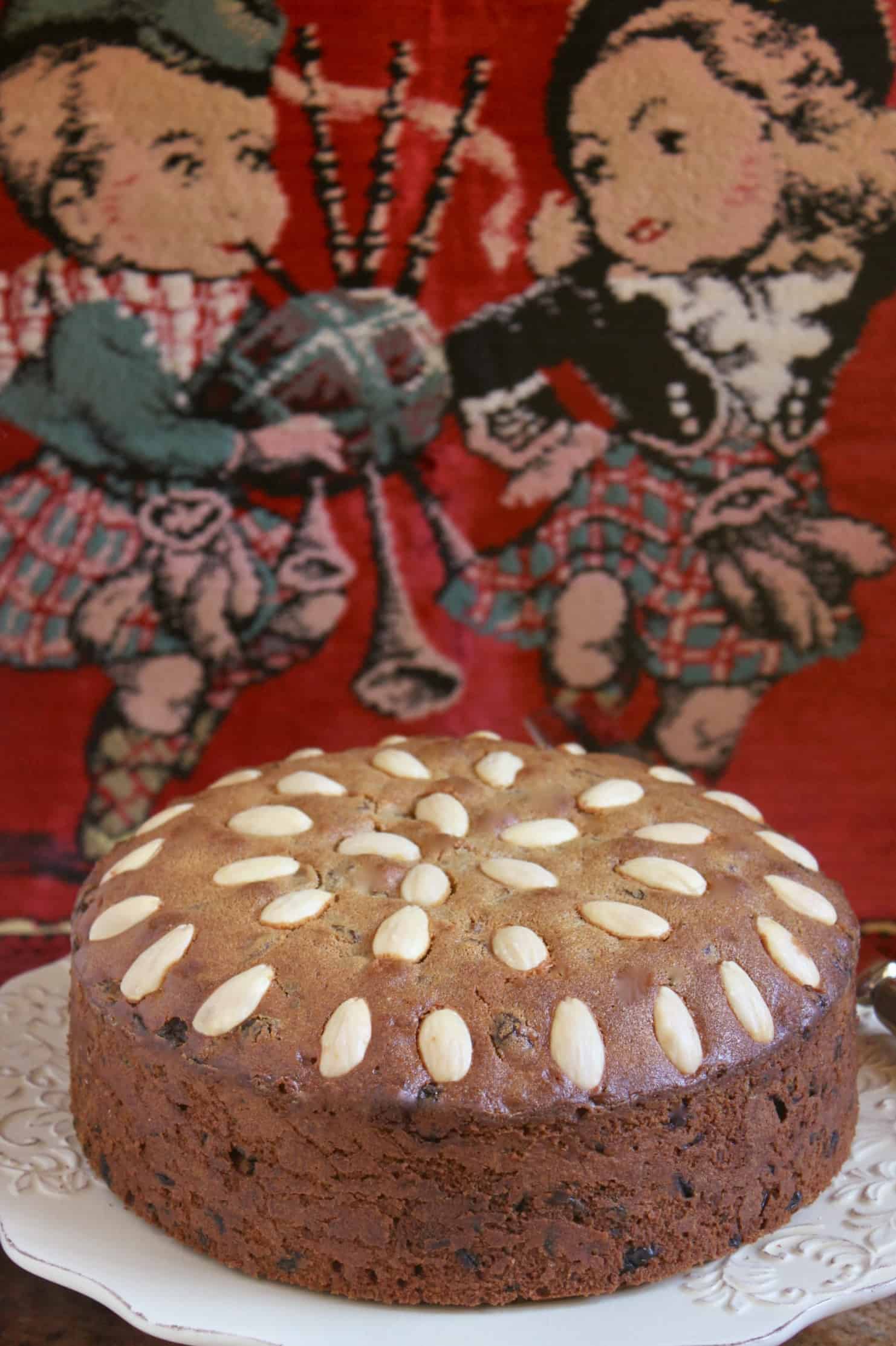 Dundee Cake with cute Scottish pillow in background