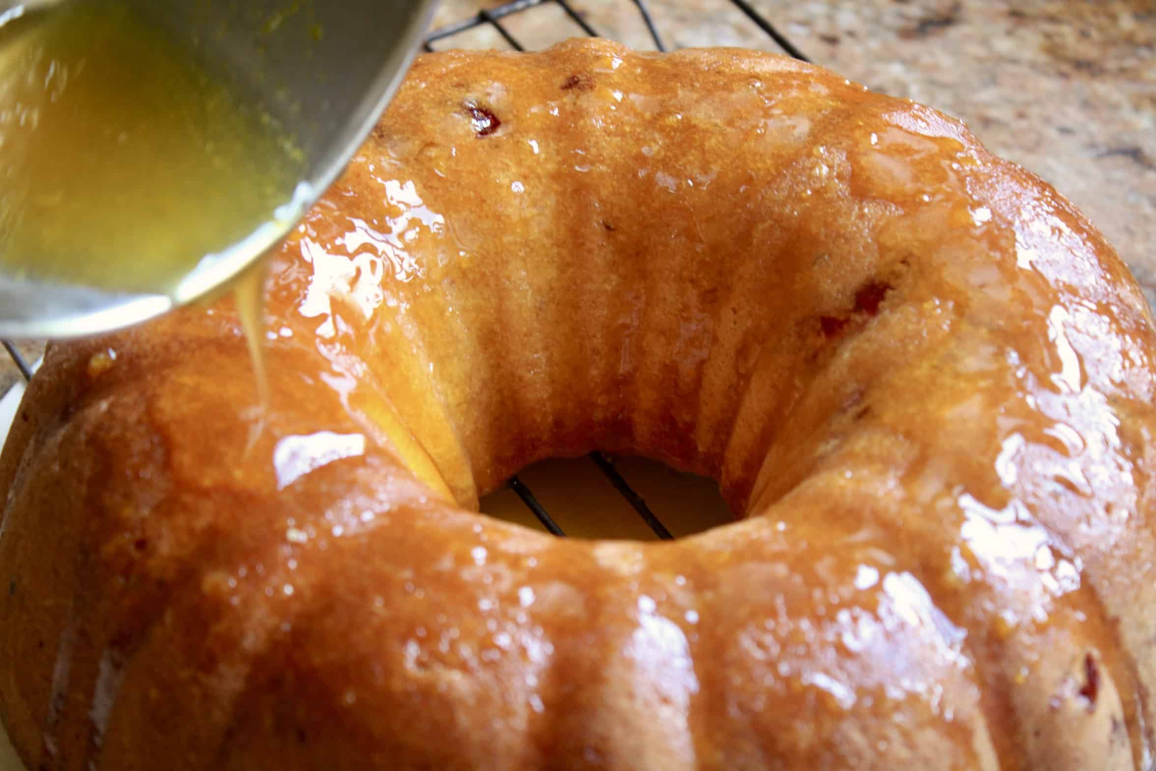 pouring glaze on cake