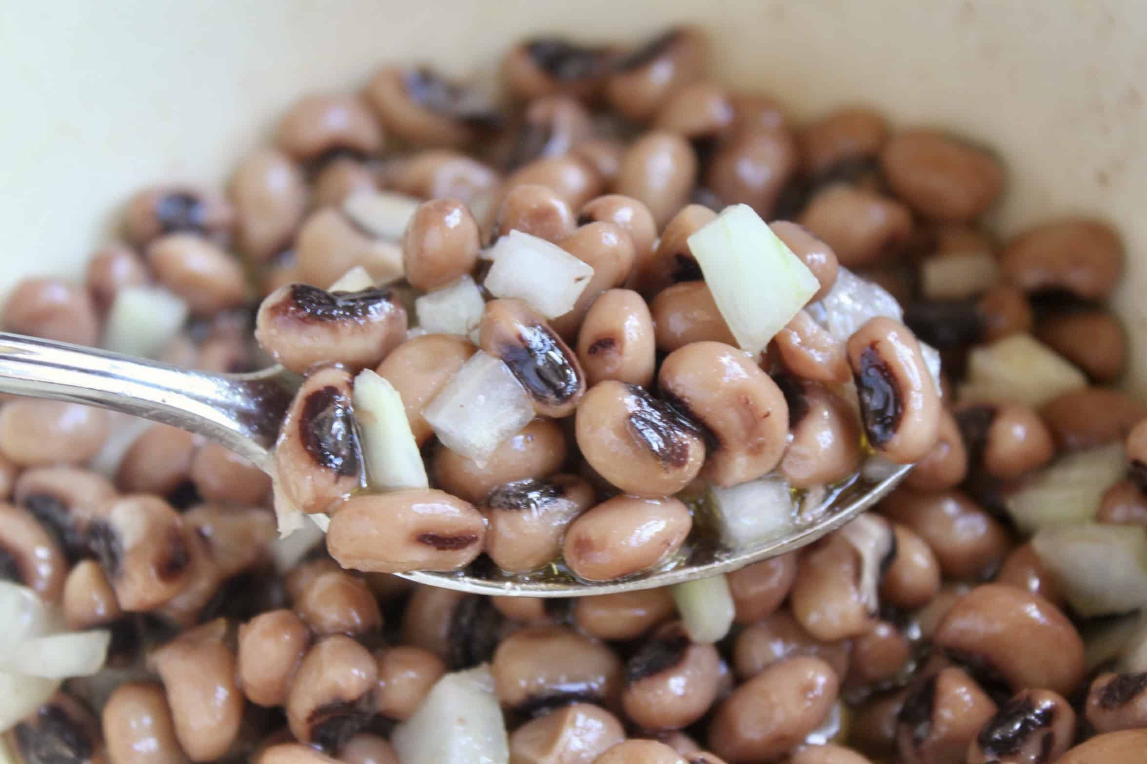 black eyed peas and onions in a spoon