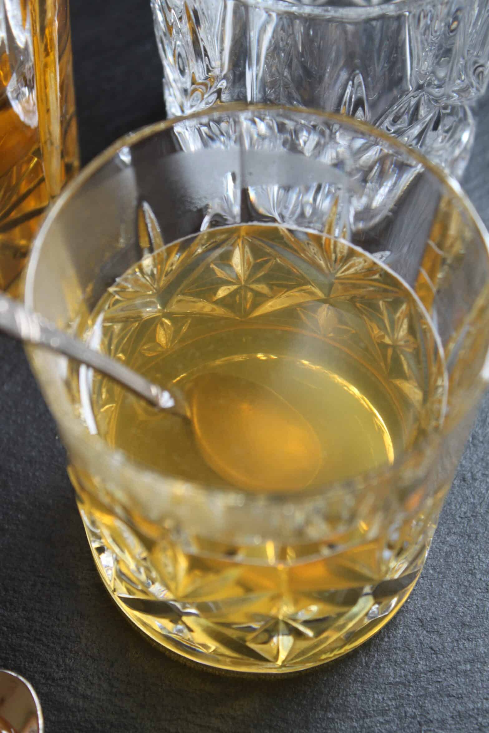 crystal glass with silver spoon and hot toddy crystal glass with silver spoon and hot toddy