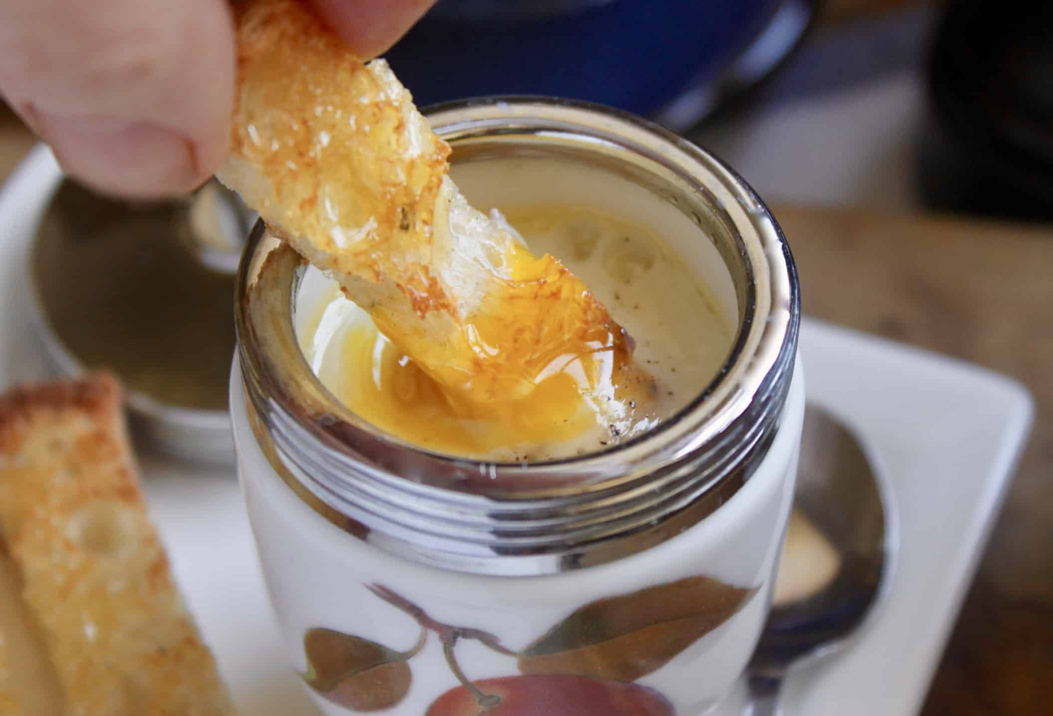 dipping toast into egg