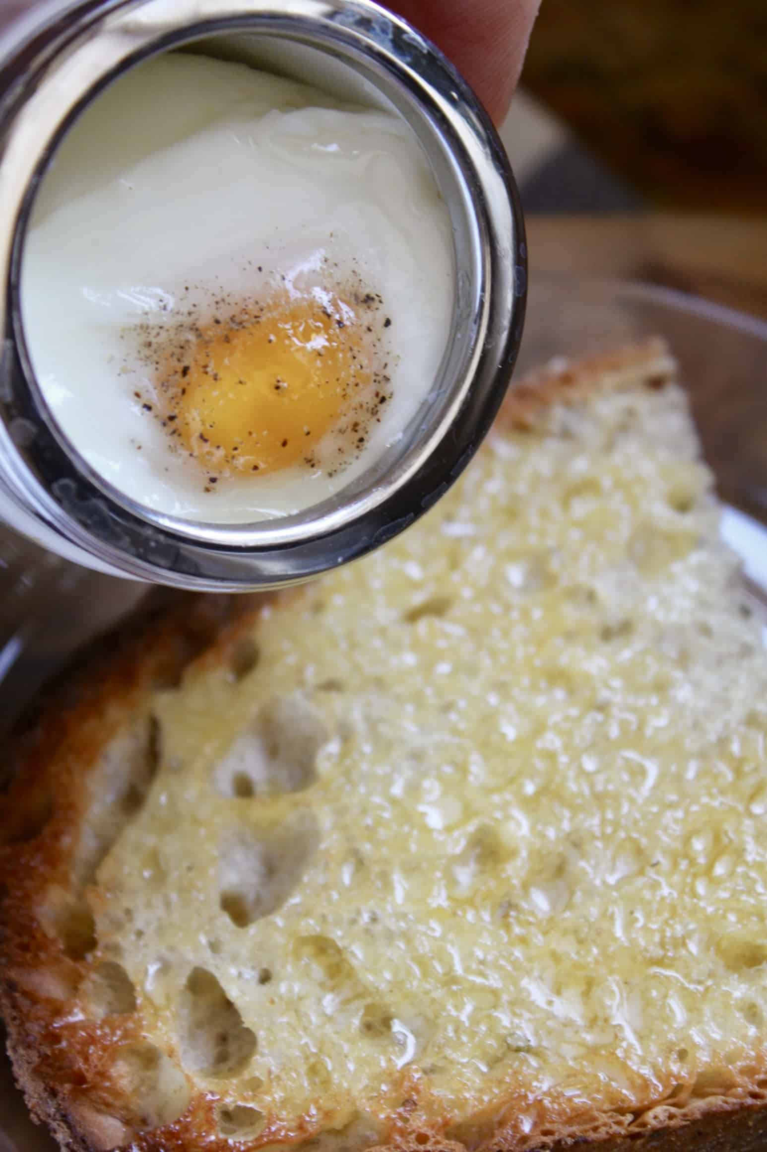 Adding coddled egg to toast