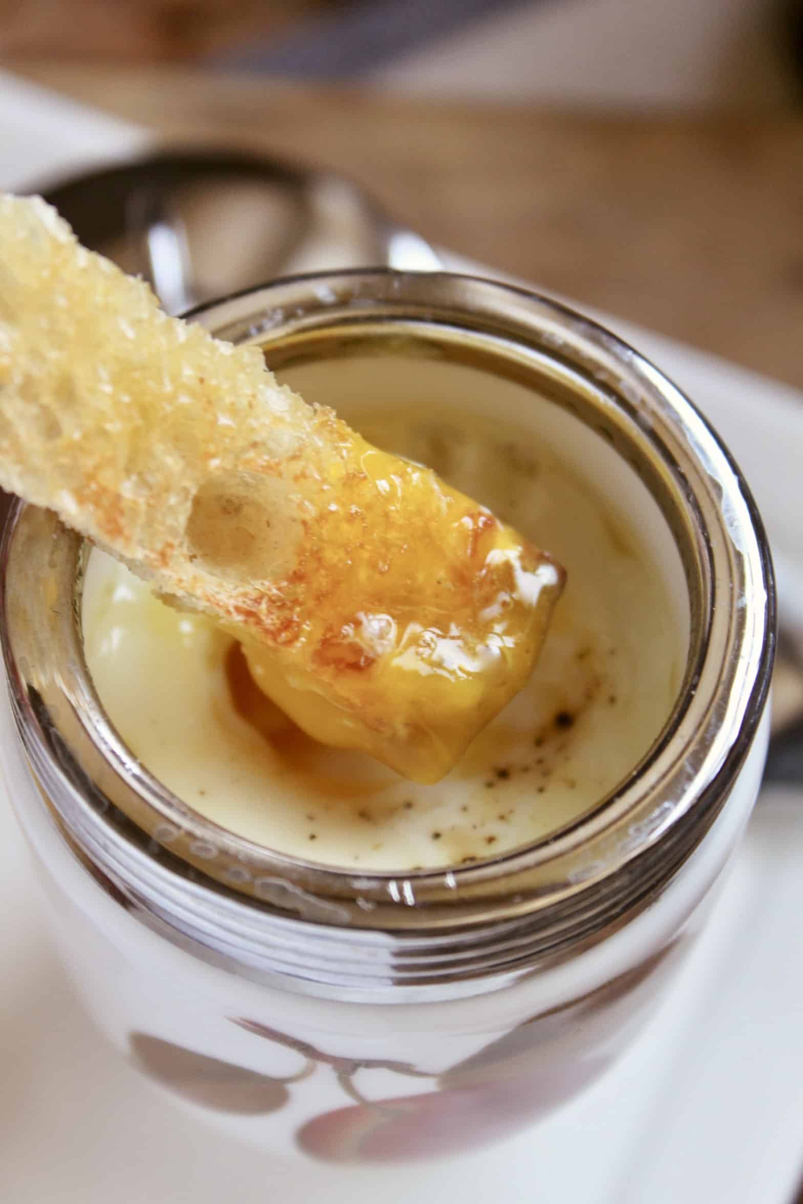 dipping toast into coddled egg