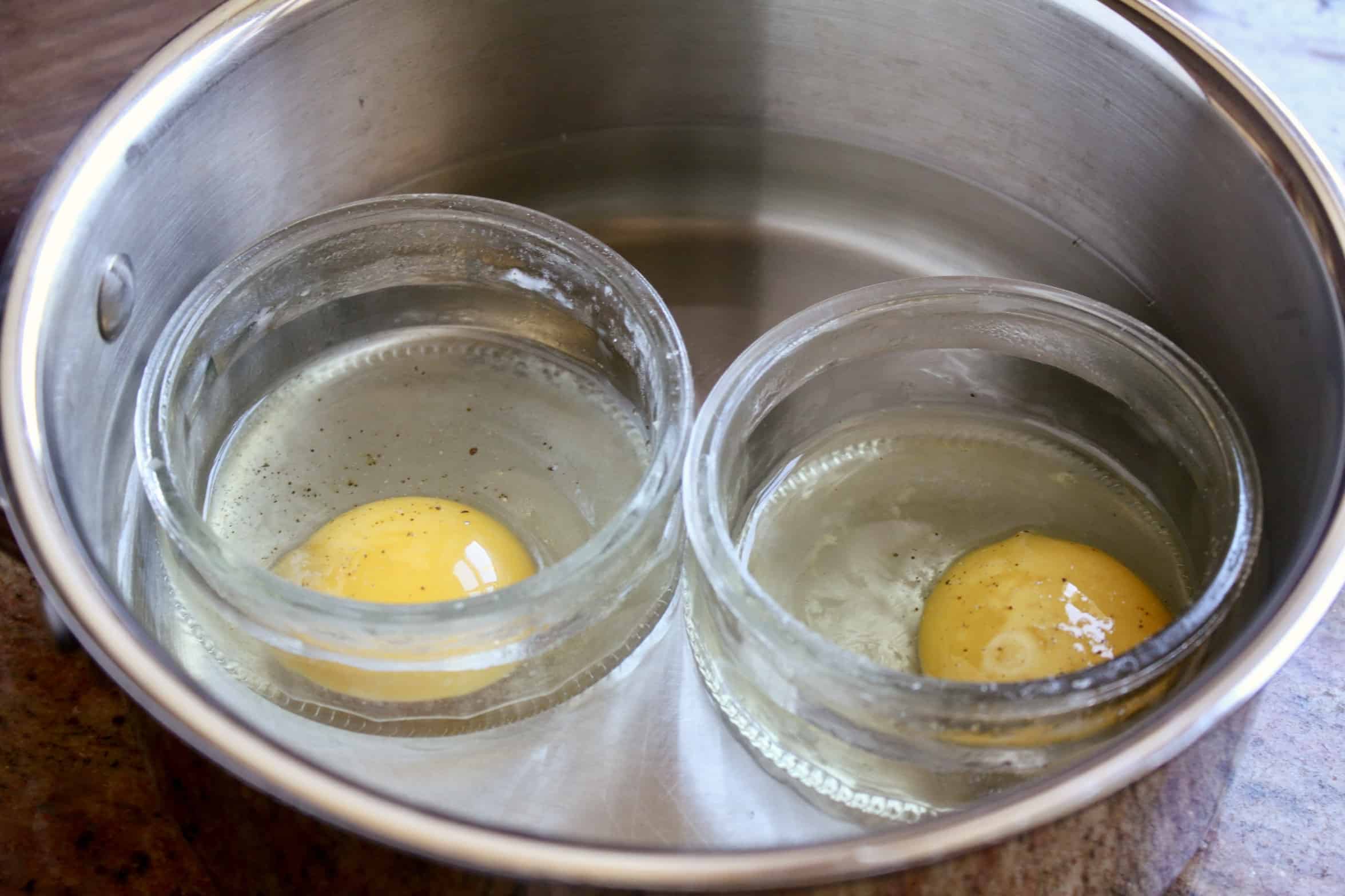 ramekins with eggs in pot