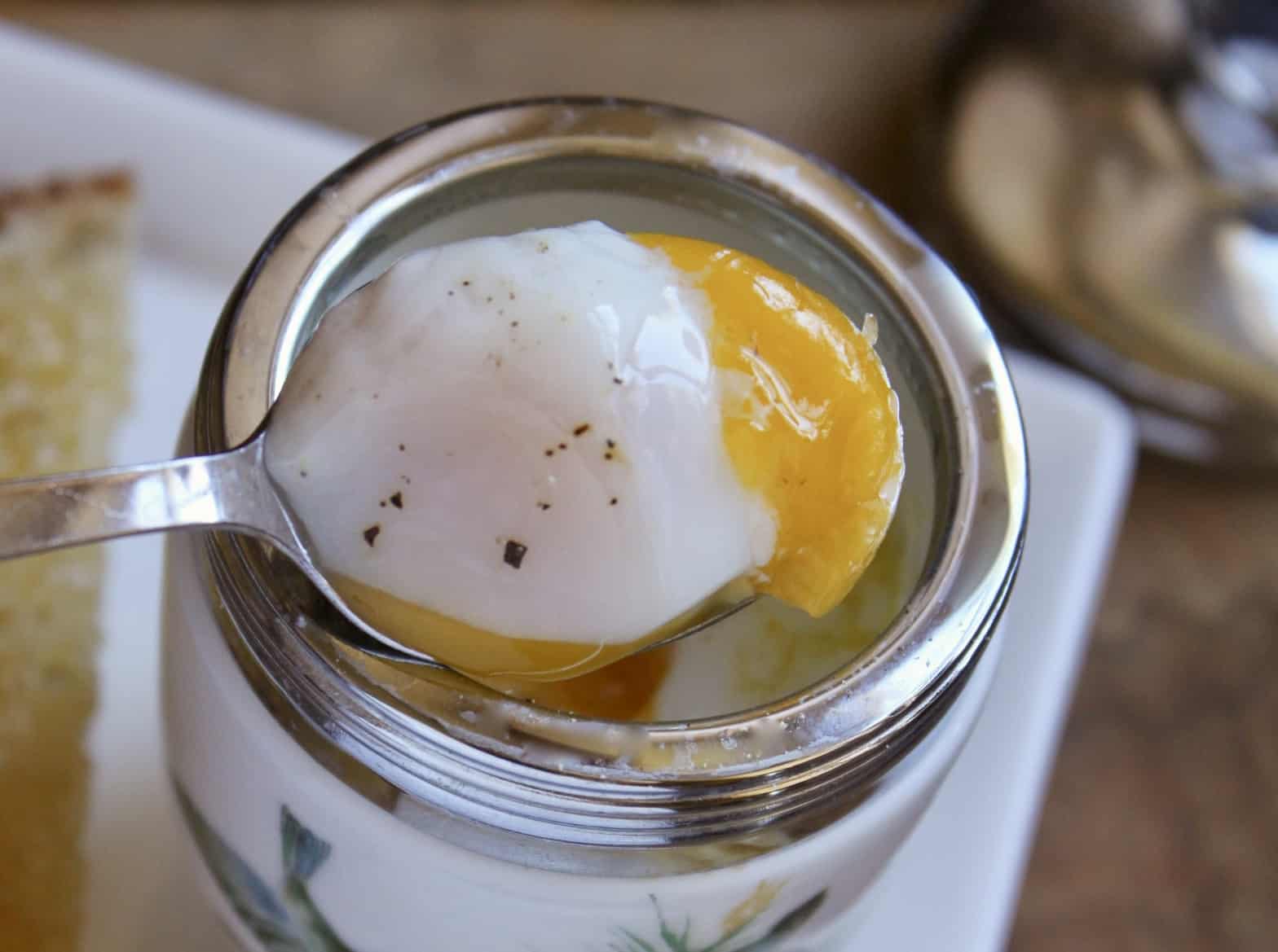 spooning out coddled egg