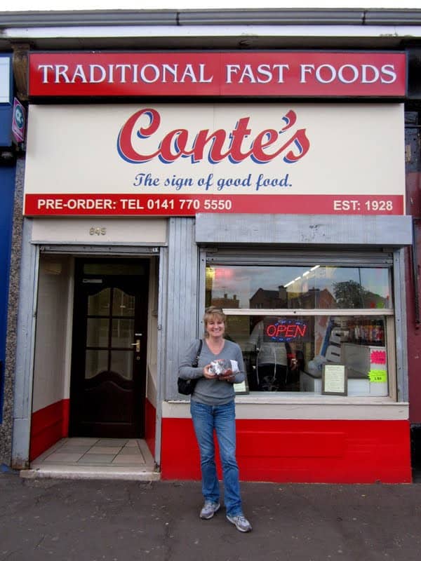 Christina in front of her dad's old fish and chip shop