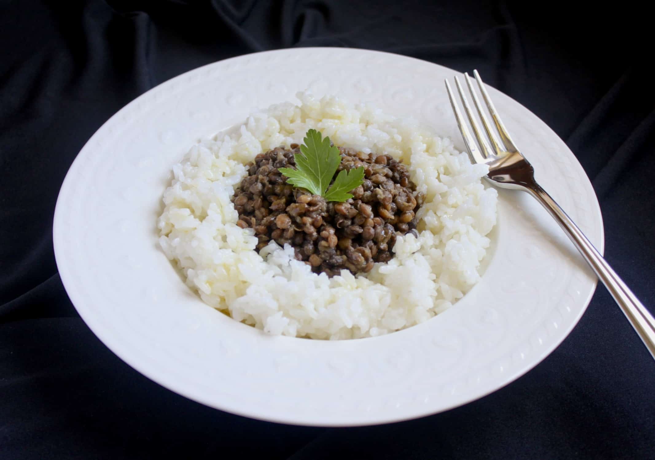 lentils and rice in a white bowl