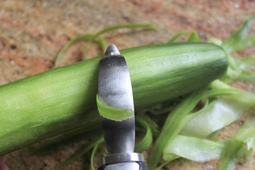 peeling a cucumber