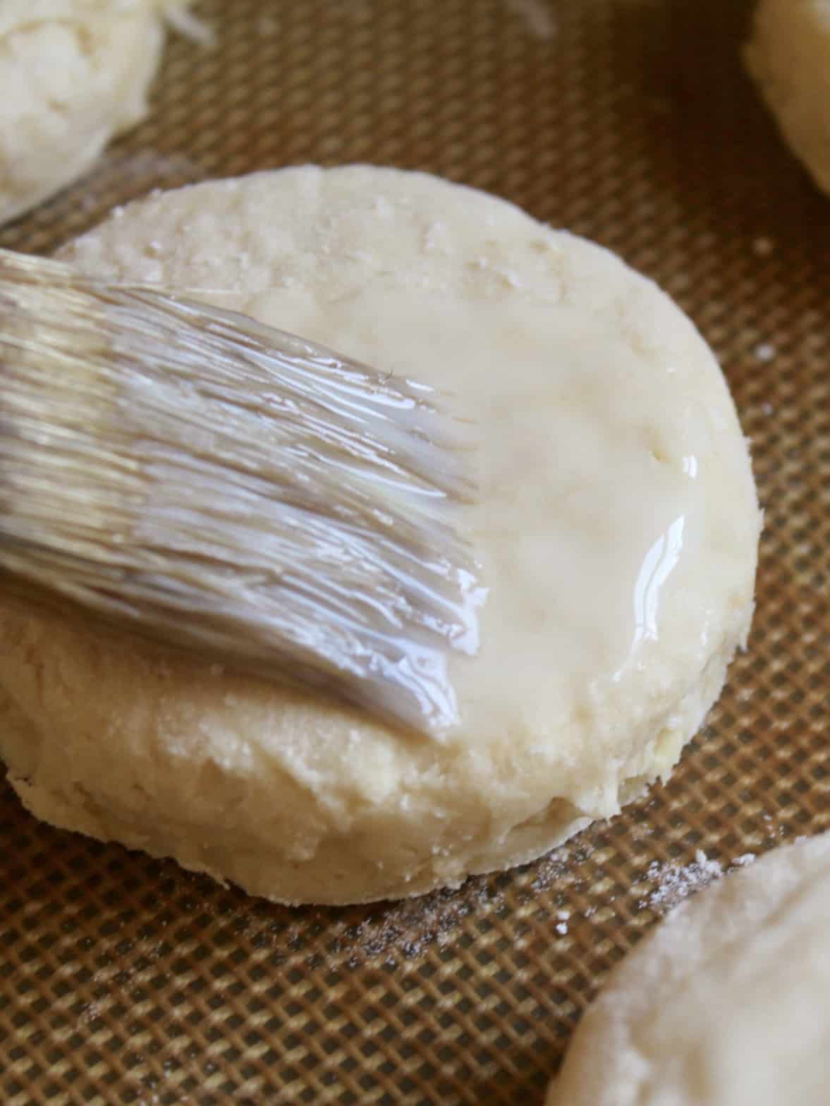 brushing savory parsnip scones with egg wash