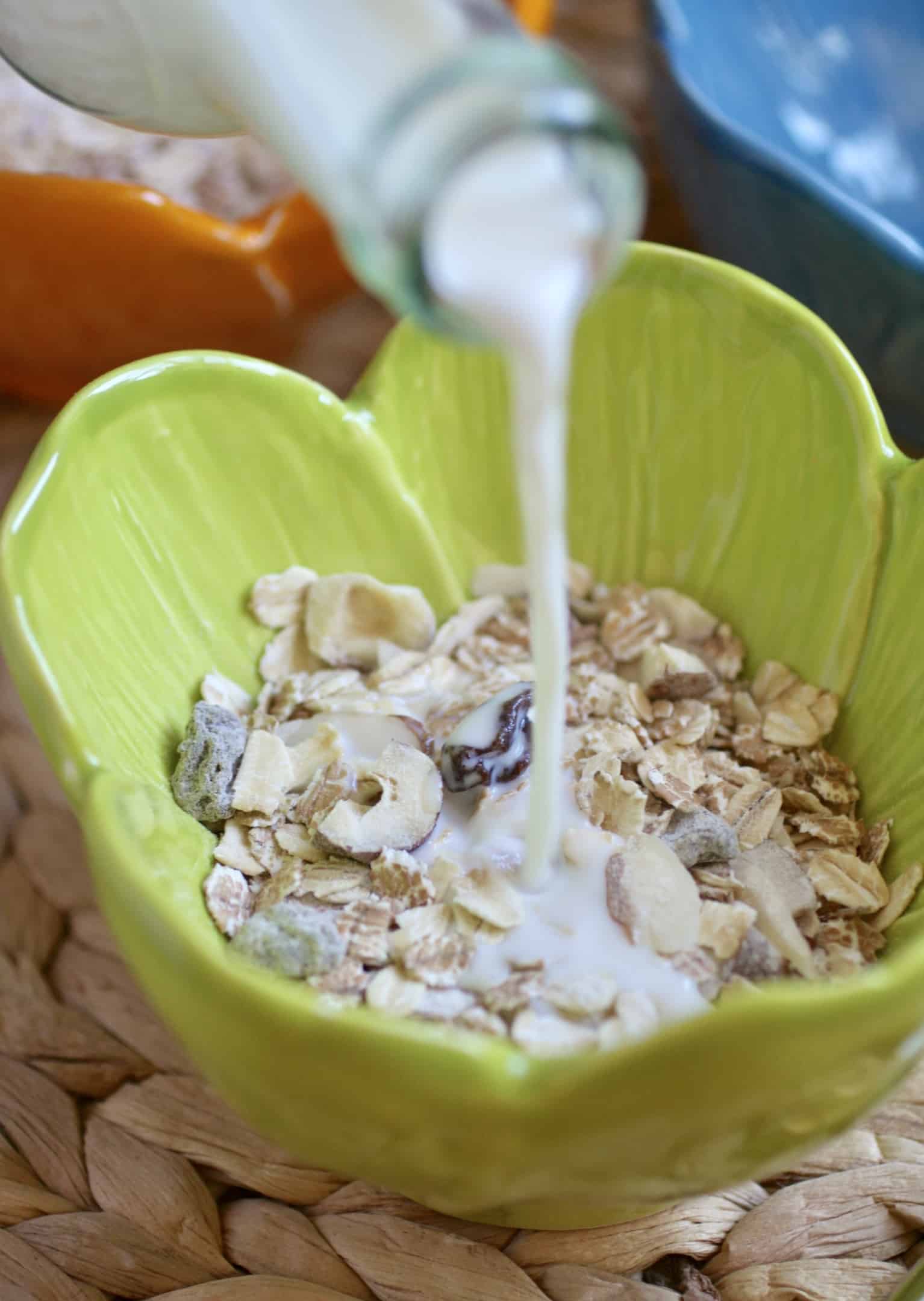 pouring milk into cereal