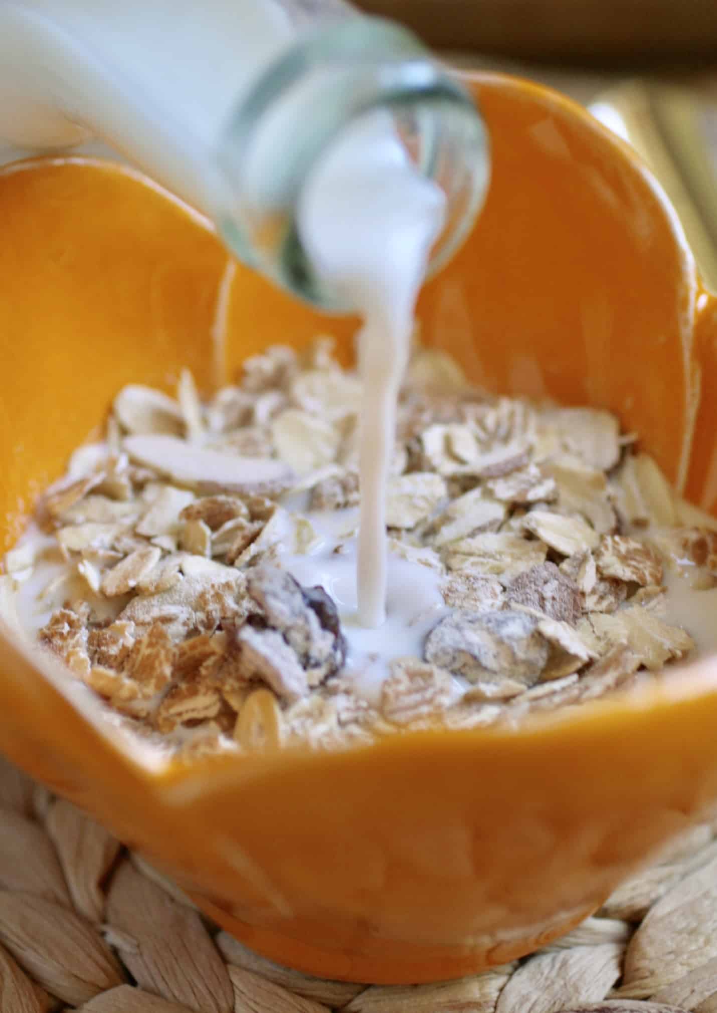 pouring milk into cereal