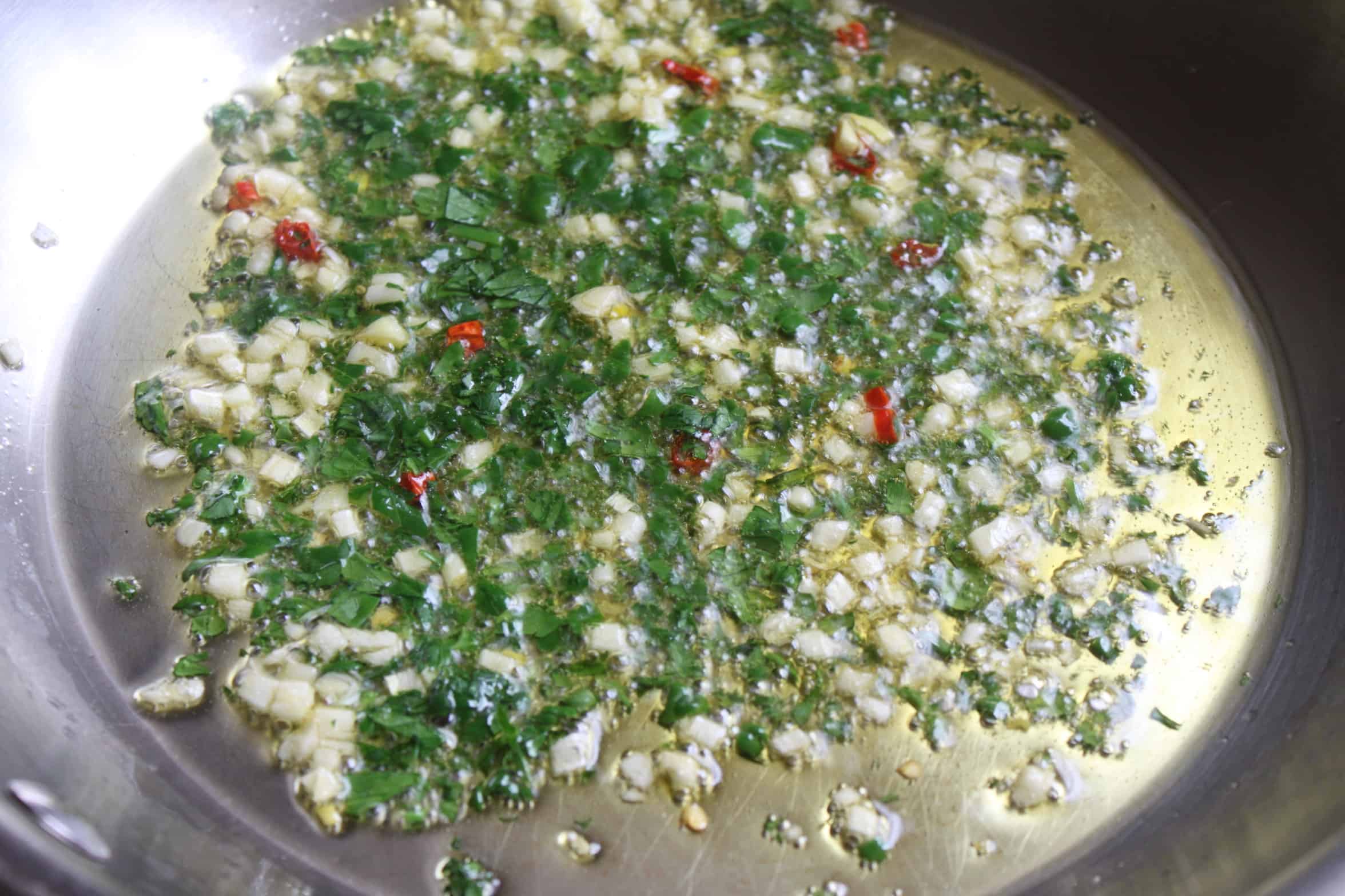 chopped garlic, hot pepper and parsley frying