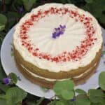 green cake in clover with flower