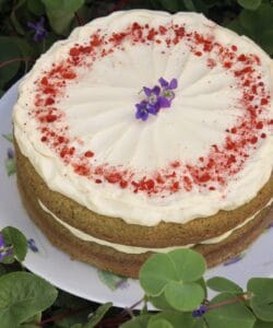 green cake in clover with flower