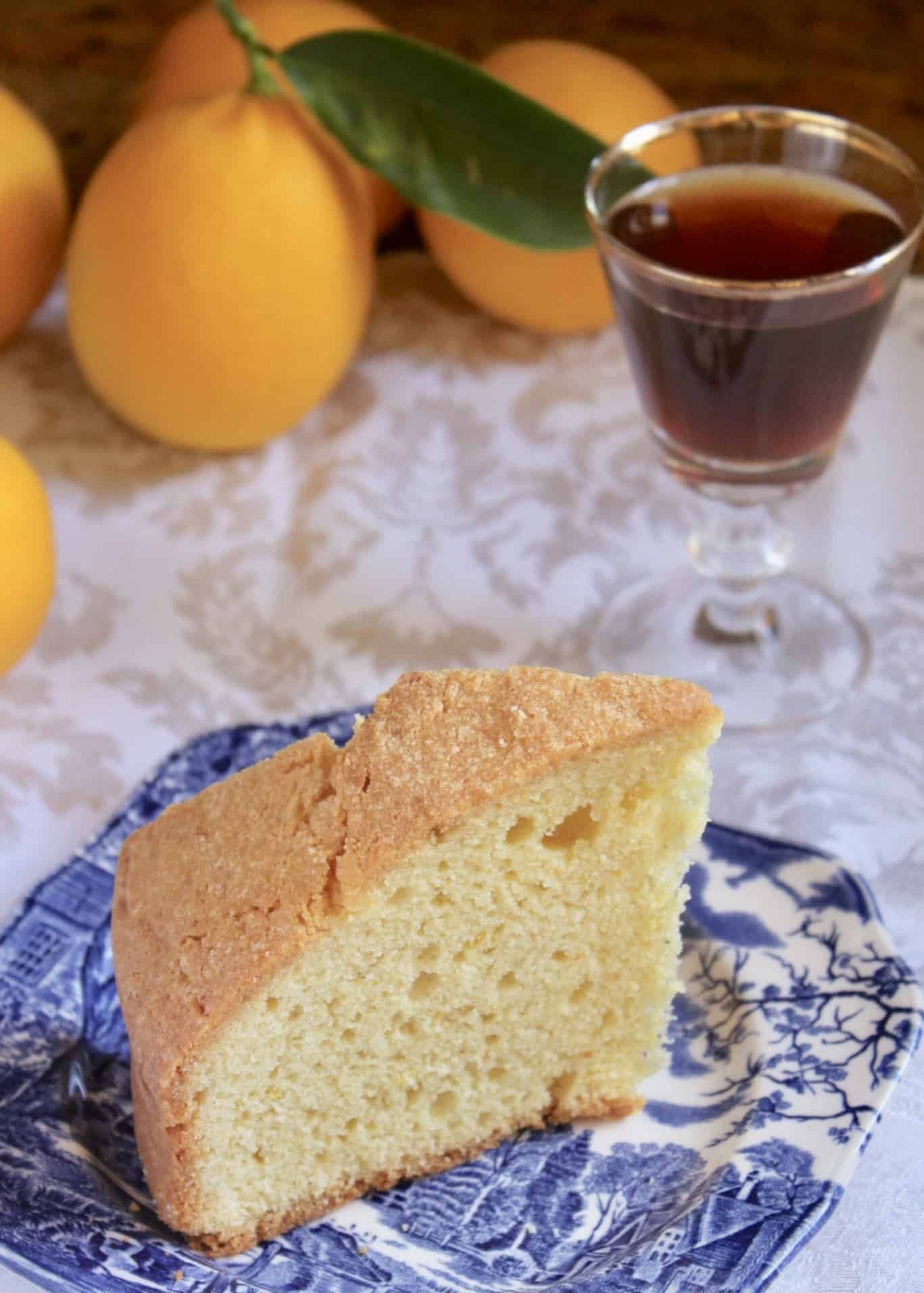 Madeira cake slice on plate with wine