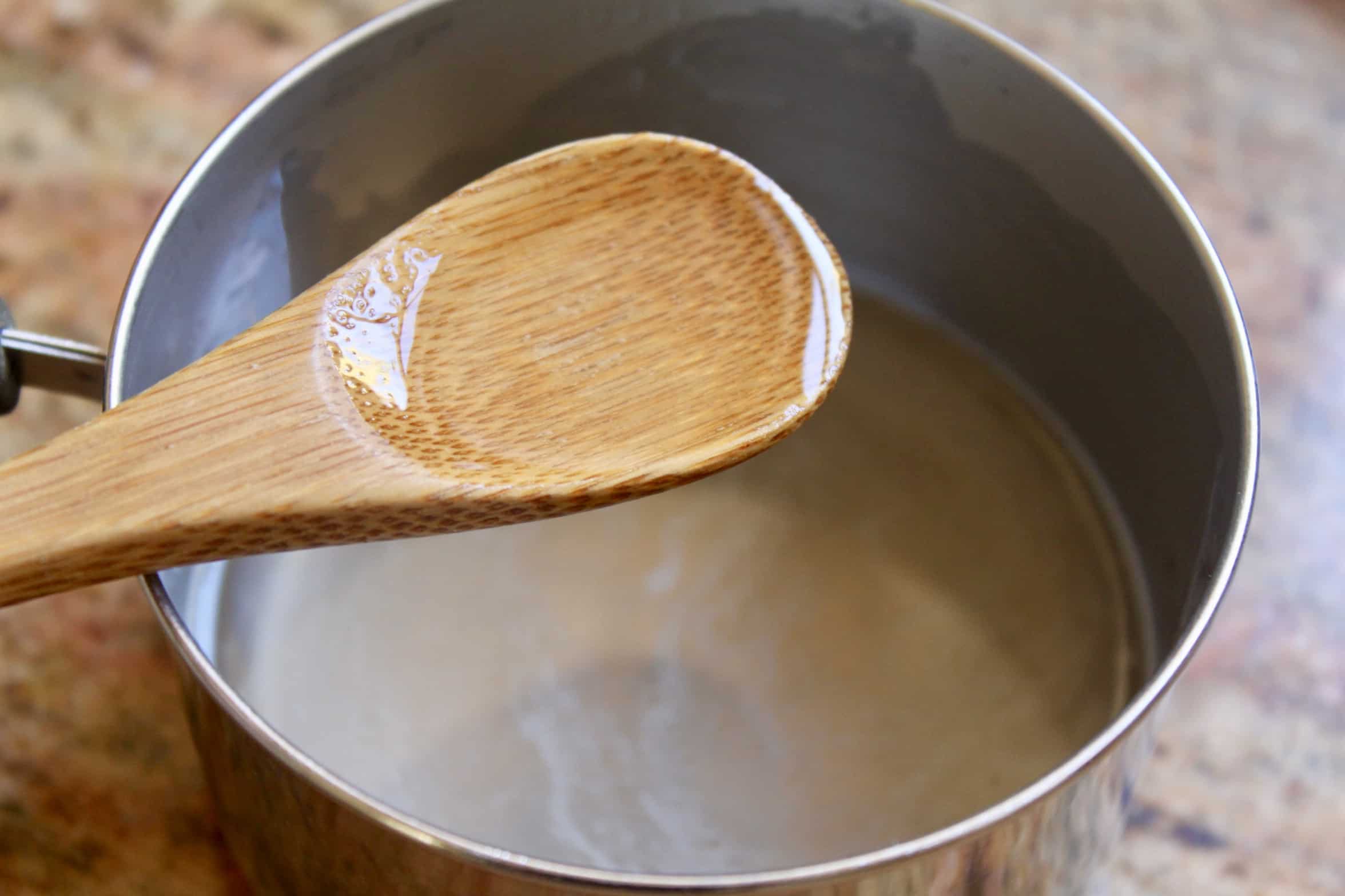 sugar syrup with wooden spoon