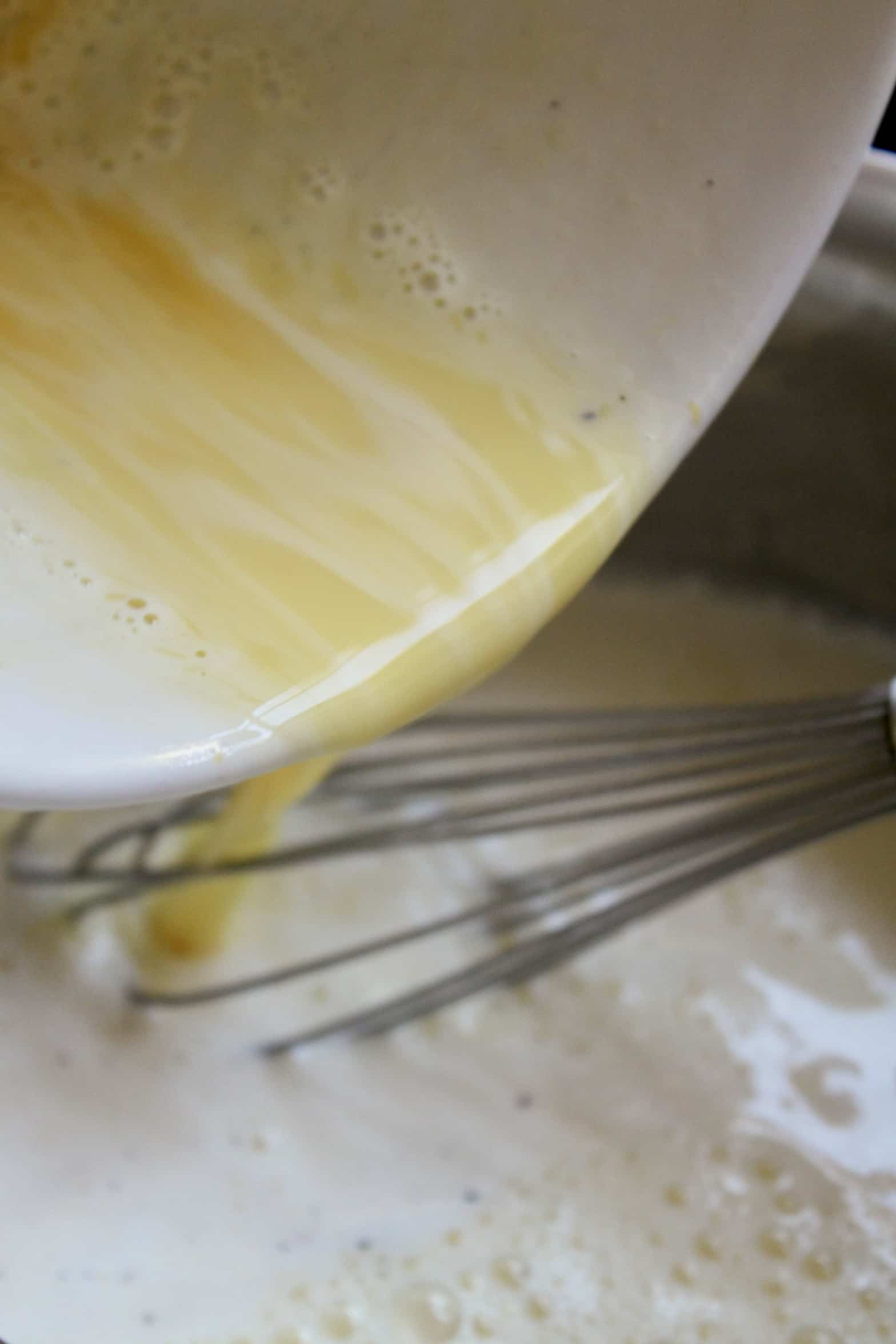 pouring egg mixture into pot