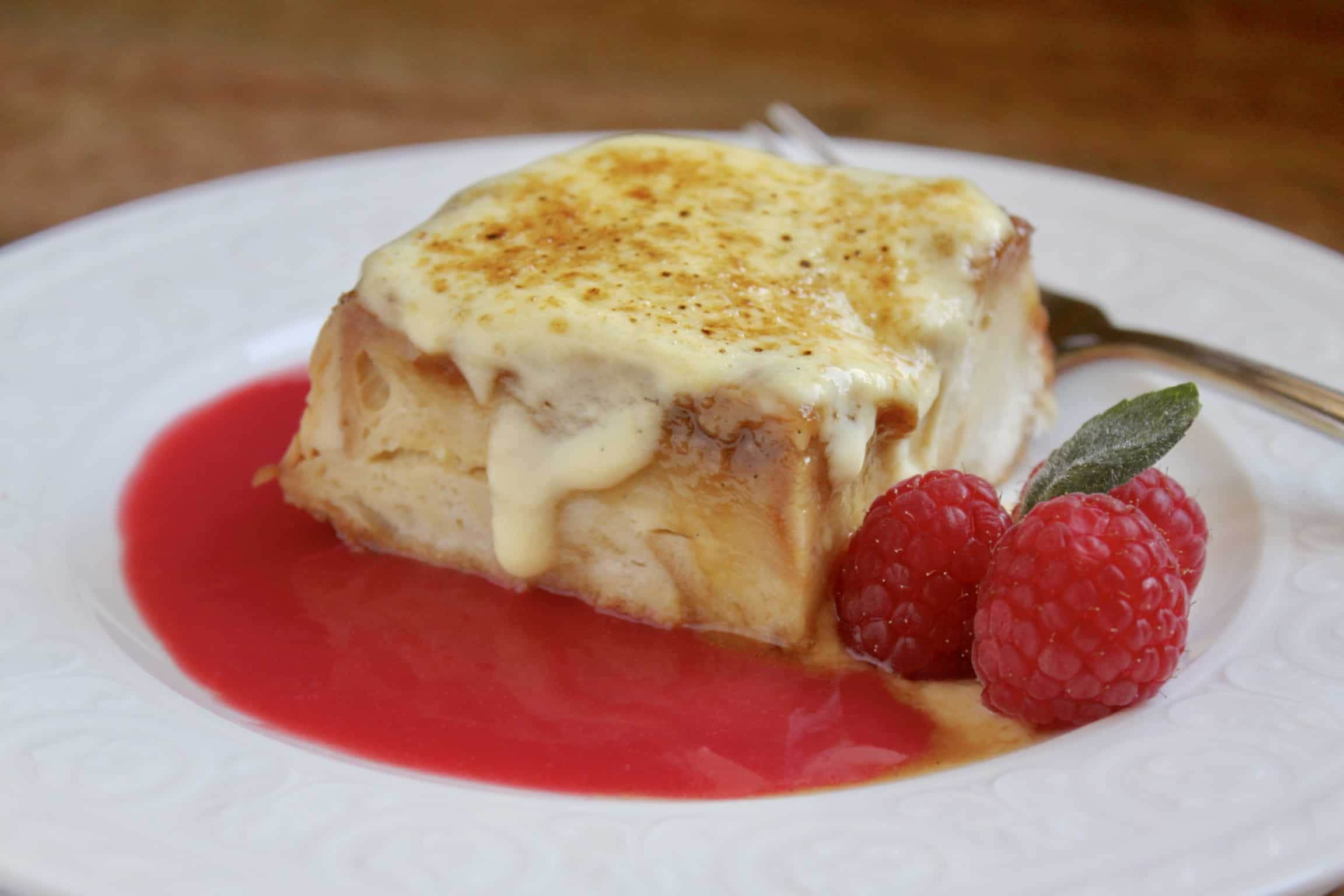 custard bread pudding with raspberry coulis