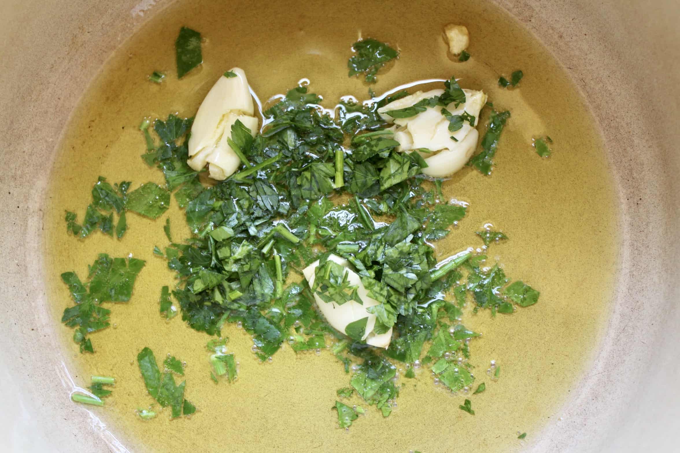 garlic and parsley in a pot
