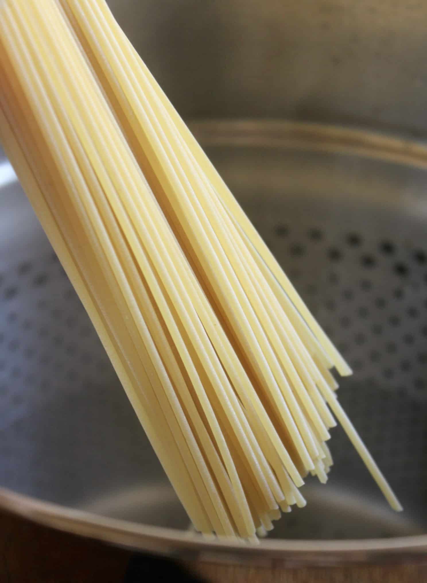 adding pasta to water