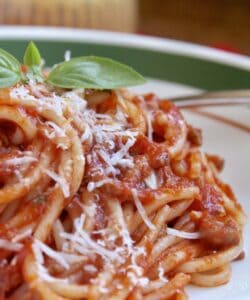 spaghetti sauce on pasta with cheese