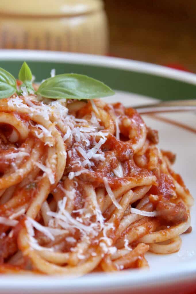spaghetti sauce on pasta with cheese