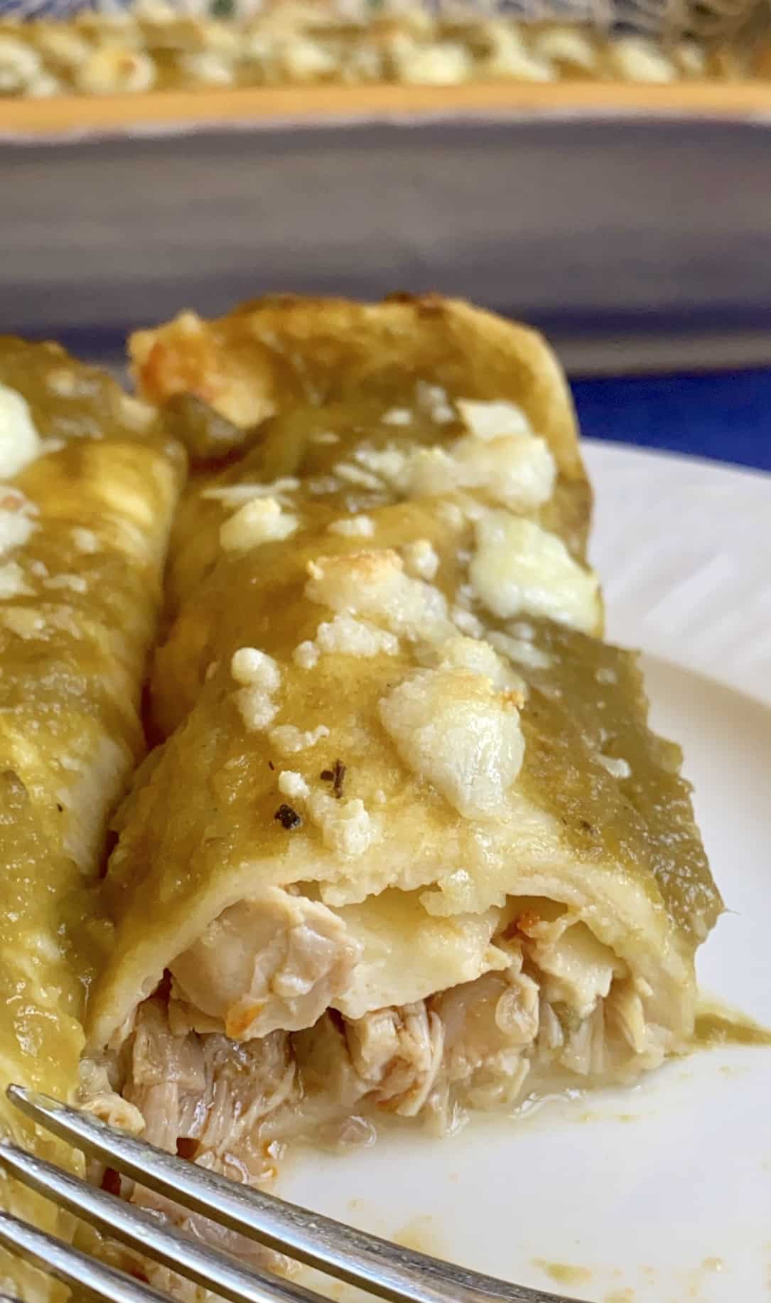 green chicken enchiladas on a plate