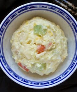 scoop of gamja salad in a bowl