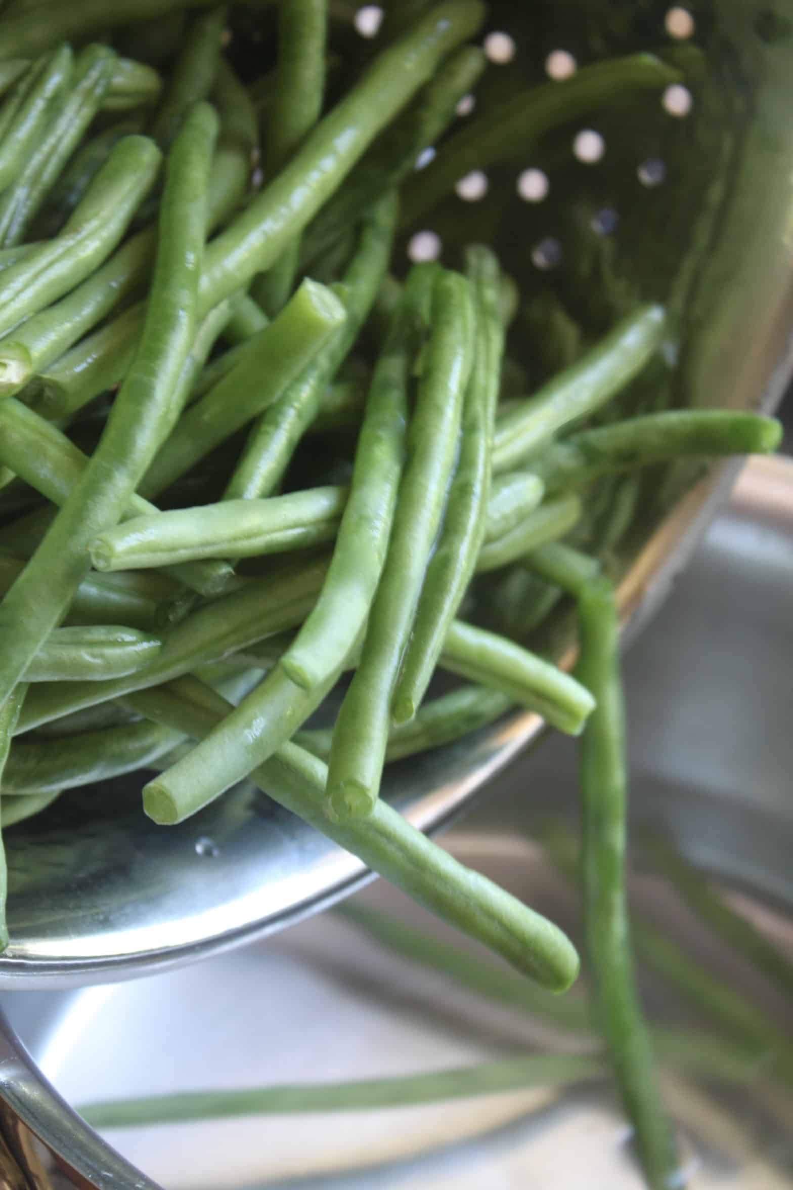 adding green beans to boiling water