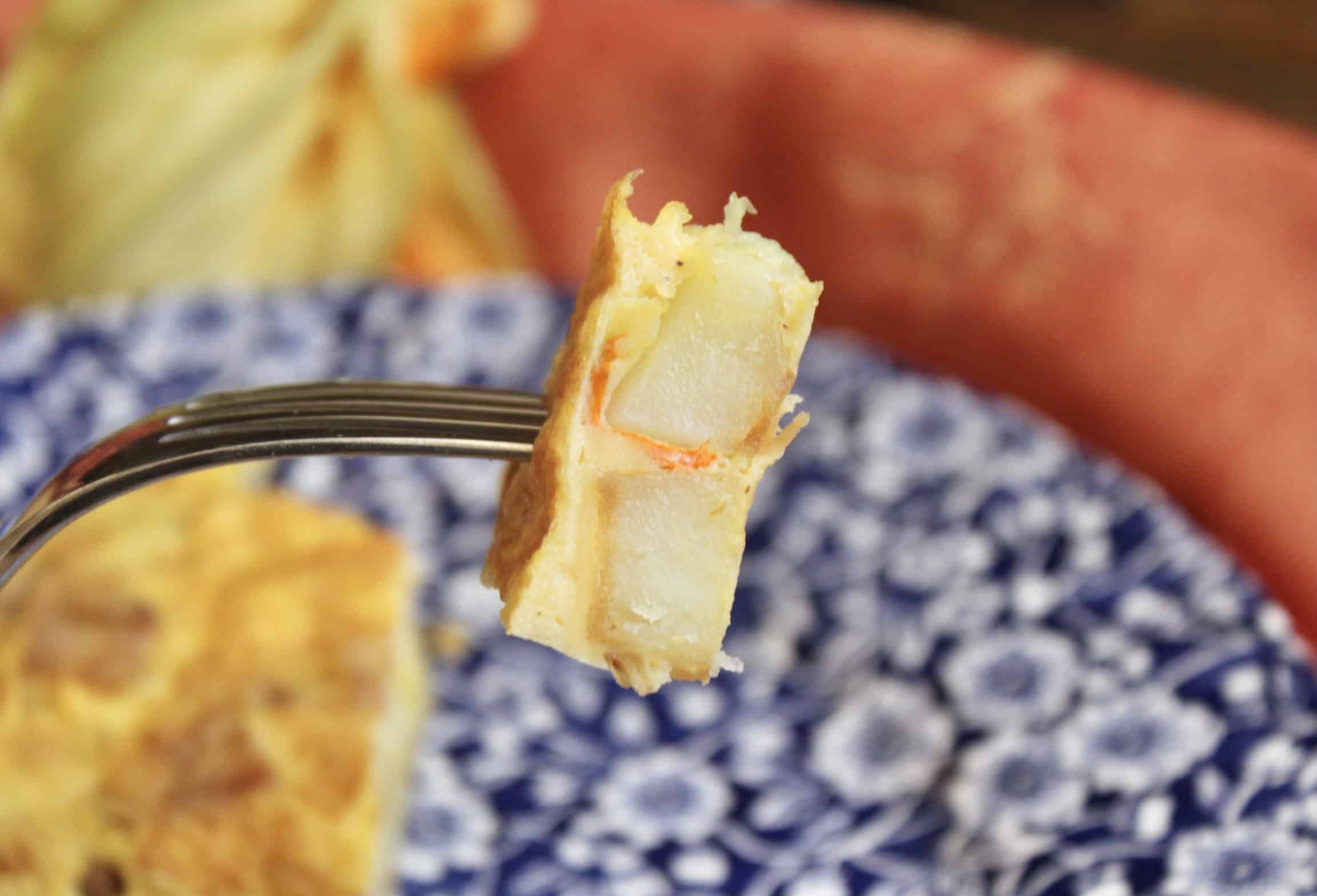 bite of zucchini blossom frittata on a fork