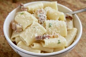 pancetta pasta in a bowl with cheese on top