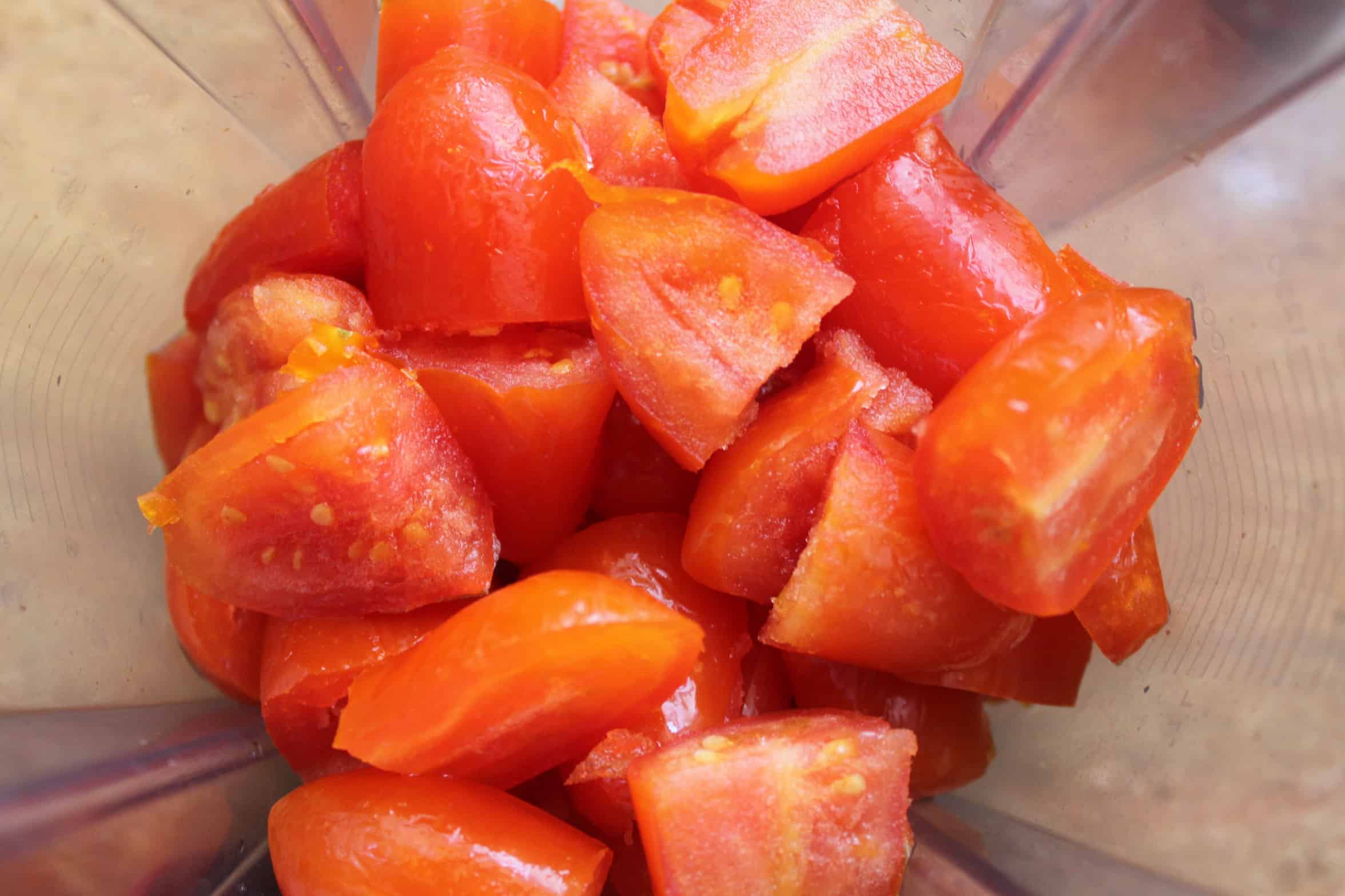 chopped tomatoes in a blender