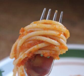 forkful of pasta with fresh tomato sauce