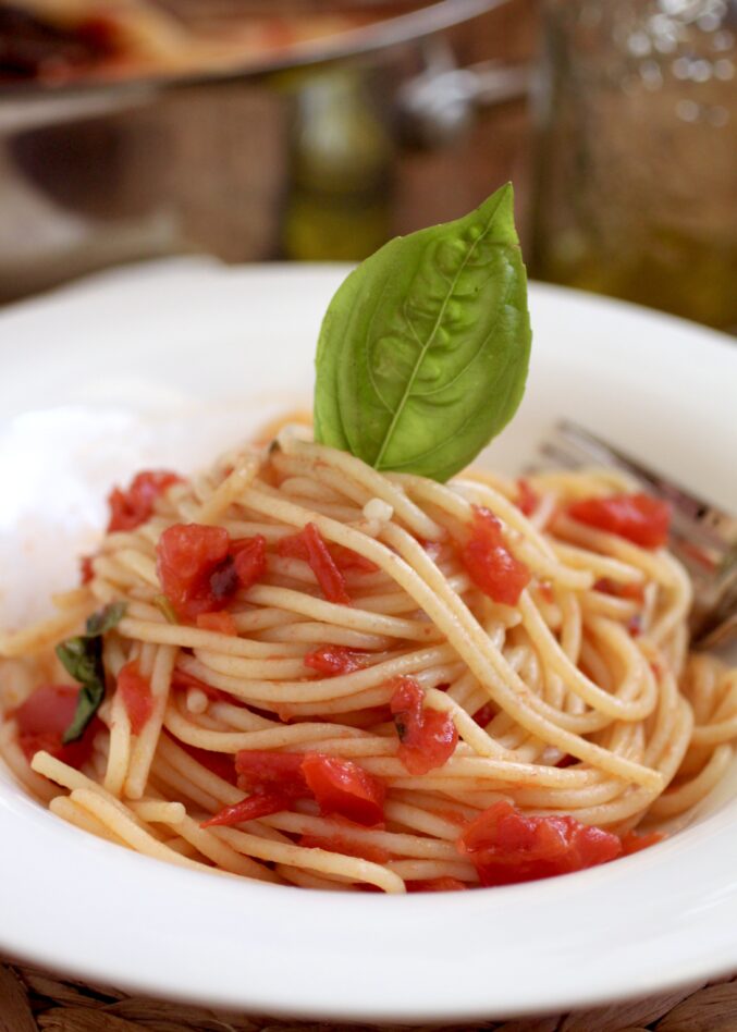 pasta sauce with fresh tomatoes on spaghetti