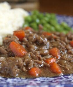 mince and tatties and peas on a floral plate