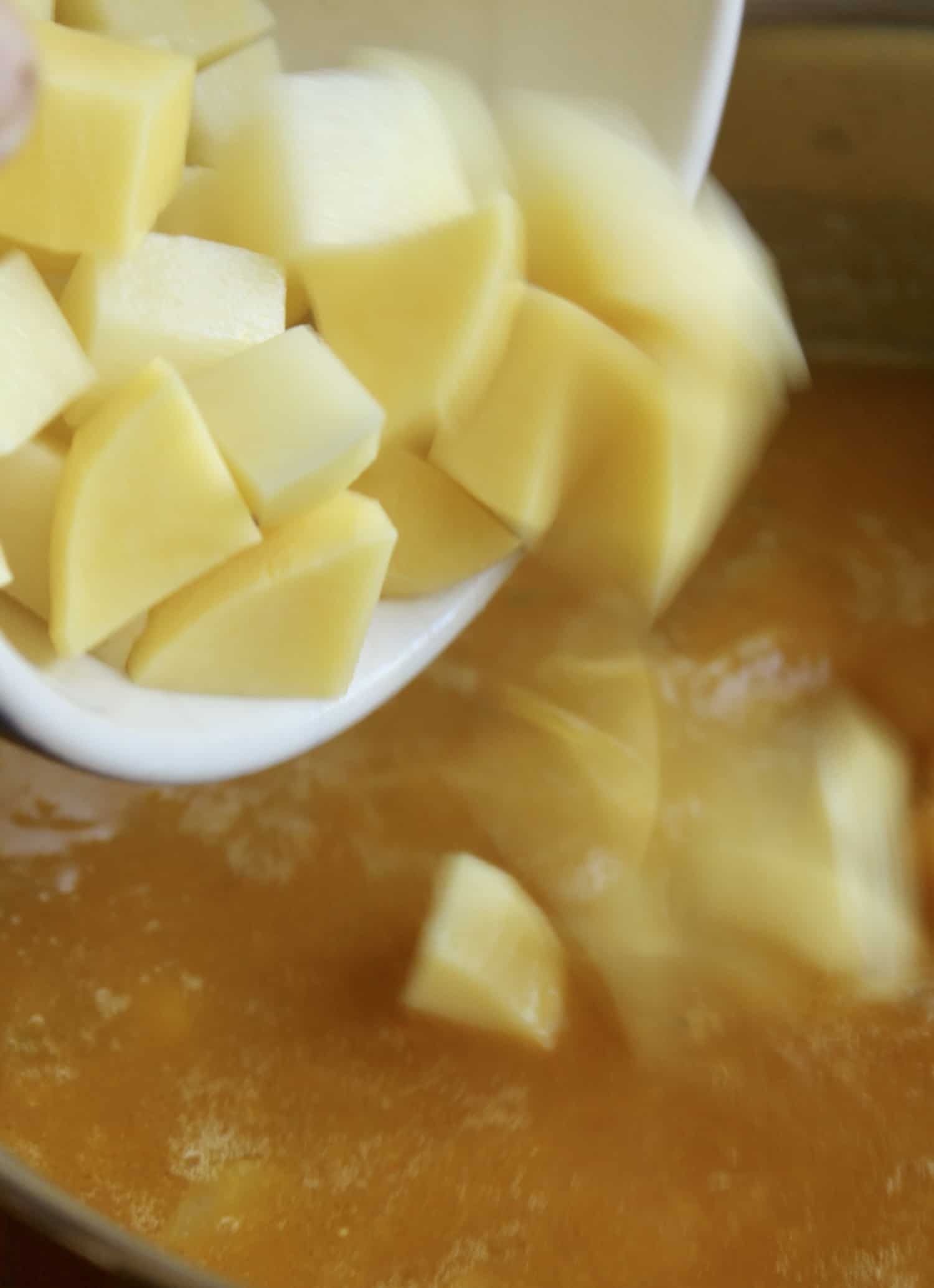 adding chunks of potatoes