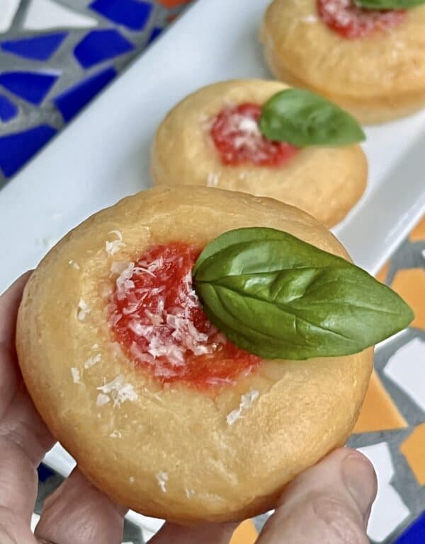 pizza donut held in hand