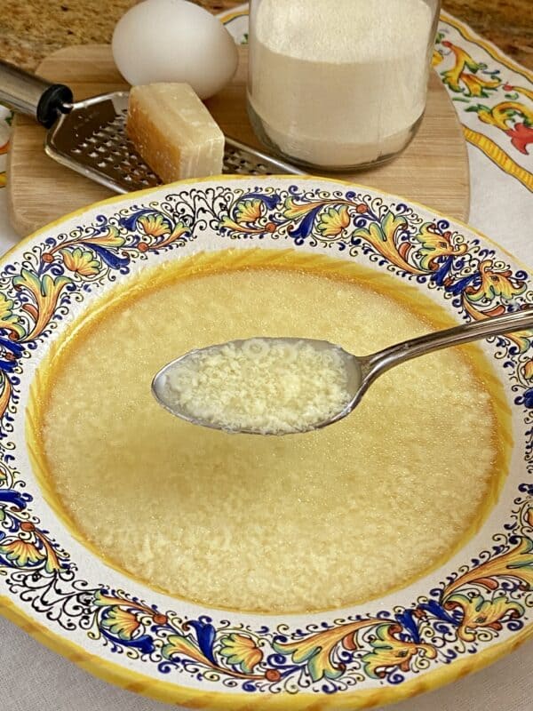 spoonful of chicken soup with stracciatella
