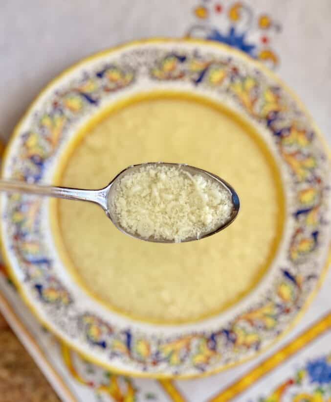 spoonful of chicken soup with stracciatella