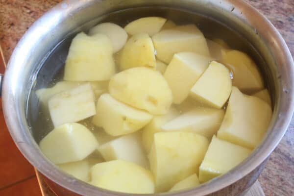 potatoes in water in a pot