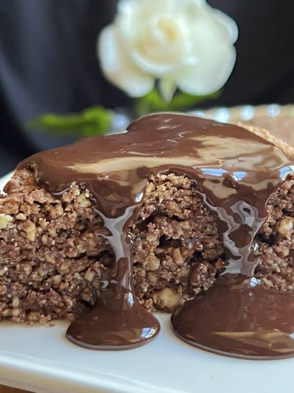 chocolate sauce poured over a slice of cake