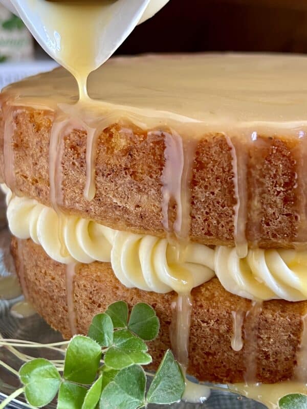 pouring glaze on whiskey cake