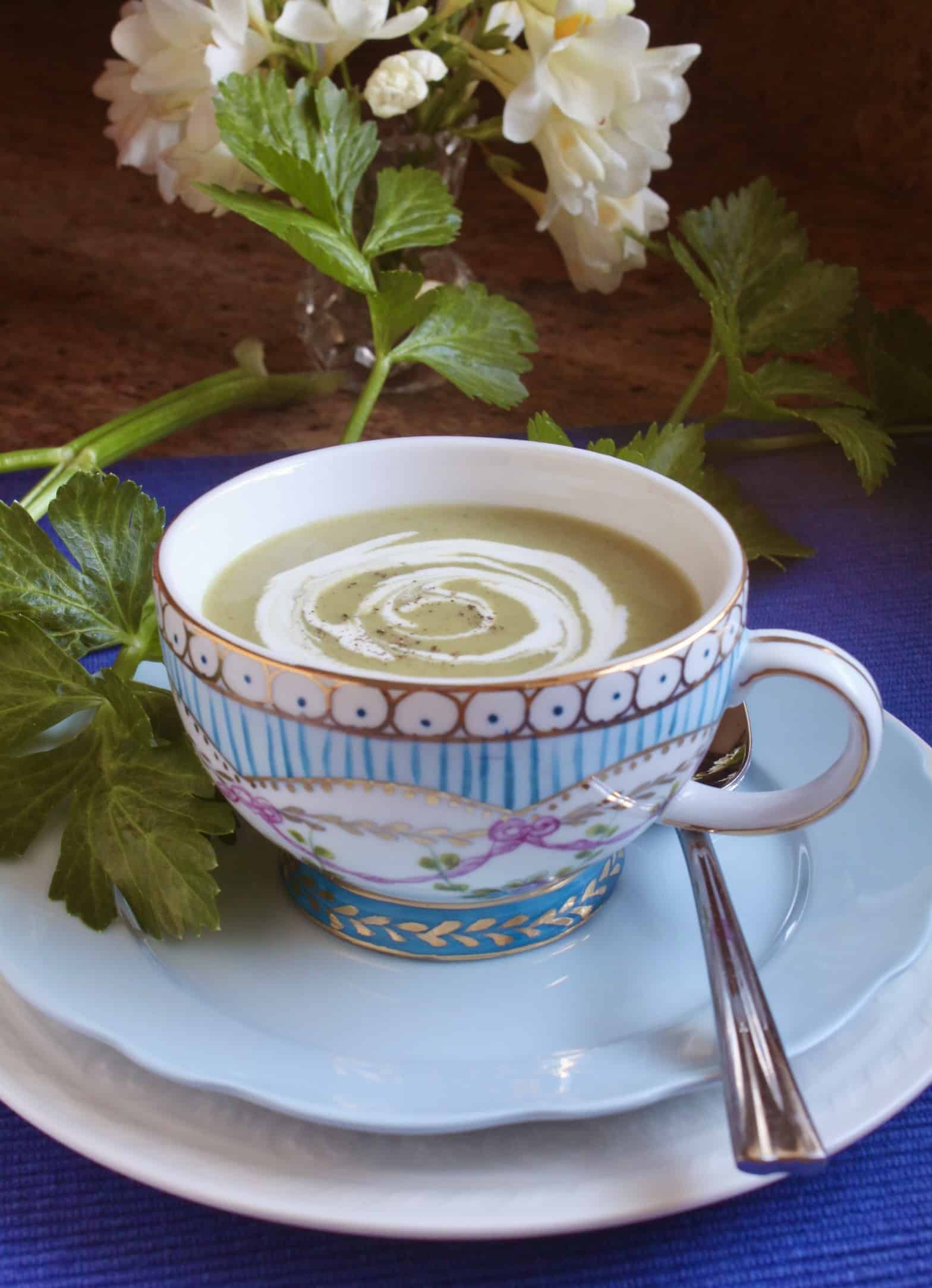 celery soup in a blue cup
