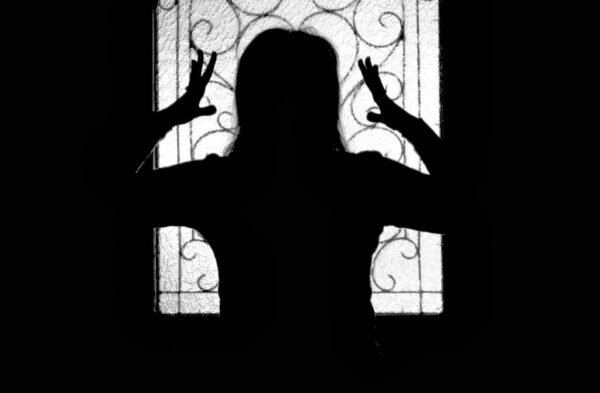 silhouette of upset woman
