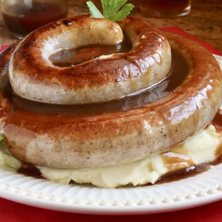 cumberland sausage link on mashed potatoes with gravy