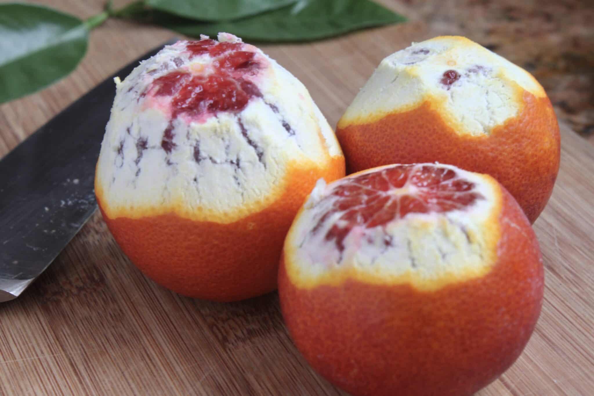 partially peeled blood oranges