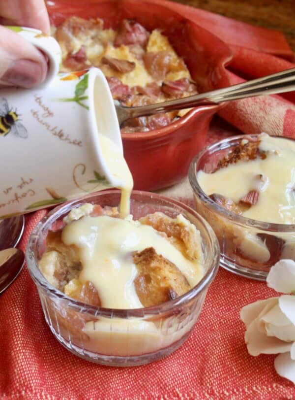 pouring orange custard on pudding