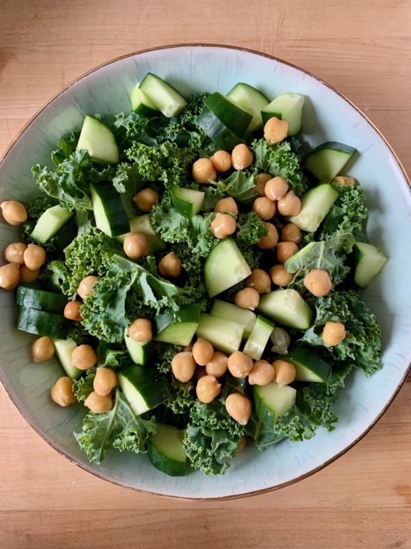 tossing the veg and beans into the bowl